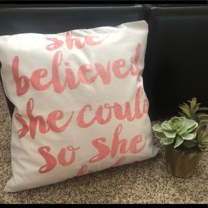 Pink and white throw pillow